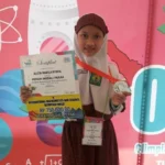 Sambil Persiapan UN, Alicia Rebut Medali di Olimpiade OMSI