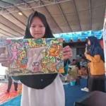 Lewat Gambar, Siswi Ini Berpesan agar Batik semakin Mendunia