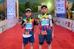 Kakak Beradik Siswa SDMM Kompak Ikuti Lari 7K di Bali