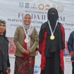 Guru Bahasa Madura SD Muhammadiyah 1 Bangkalan Raih Emas Jemparing Putri FORDA II Jatim 2024